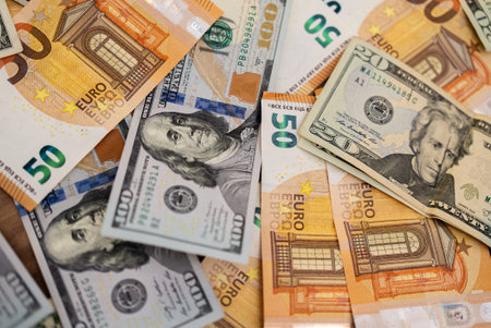 Dollar and euro bills illustrate concept of currency correlation helping anticipate market reactions...