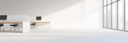 Sunlight flooding an open office space with large windows and empty workstations creates a bright, spacious environment perfect for highlighting company cultureの素材