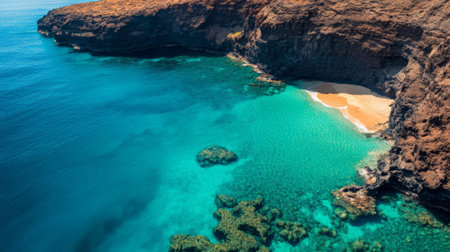 Crystal clear turquoise water gently caressing golden sands at papawai point beach, surrounded by dramatic volcanic cliffs in maui, hawaii, showcases breathtaking natural beautyの素材