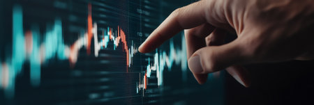 Businessman pointing at a declining stock market chart on a digital screen, analyzing financial data and monitoring market trends, reflecting concerns over investment risks and economic downturnsの素材