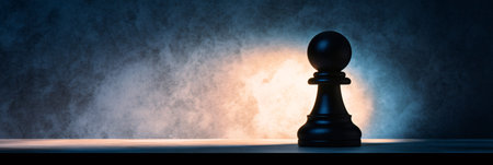 Single black pawn illuminated by a dramatic light on a wooden table against a dark textured background, representing strategy, tactics, and the intellectual challenge of chessの素材
