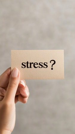 Hand holding a card with the word stress highlighting the concept of stress management and relief. Emphasizes the importance of addressing stress through effective therapy and time managementの素材