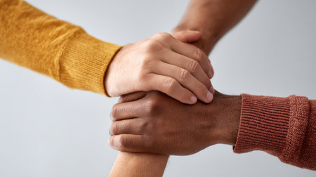 Diverse activists joining hands, peacefully demonstrating against immigration enforcement, advocating for human rights and social equality across urban street landscapeの素材