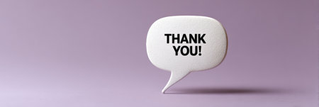 White speech bubble showing a thank you message, communicating gratitude, appreciation, and positive feedback in a clean, modern style with copy space on a vibrant purple backdropの素材