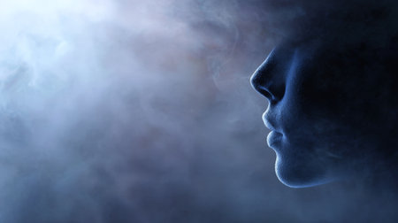 Human head profile dissolving into ethereal blue smoke and mist, evoking fading memory, introspection, mental health, dreams, and the transient nature of identity and thoughtの素材