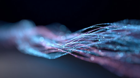 Fiber optic strands intertwine in flowing blue and purple waves with glowing particles and soft bokeh, visualizing high speed data transfer, global network and modern communication technologyの素材