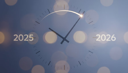 Clock hands are moving forward on a timeline marking the transition from the year 2025 to 2026, symbolizing a new year, future time, and a fresh start with bokeh backgroundの素材