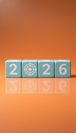 Wooden blocks forming 2026 with a target symbol, representing clear objectives, strategic planning, and future ambitions for business or personal resolutions on an orange backgroundの素材