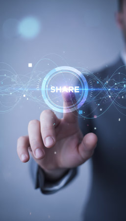Businessmans hand presses a holographic share button on a futuristic digital screen, symbolizing global connectivity, collaborative social media interaction and modern business networkingの素材