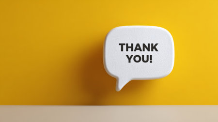 White speech bubble showing a thank you message, symbolizing gratitude, appreciation, and communication on a vibrant yellow background with clean minimalist stagingの素材