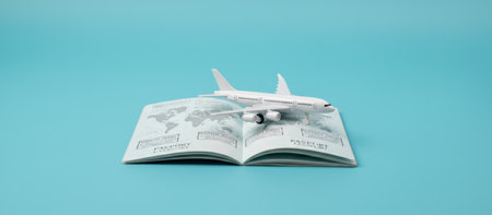 Travel passport document laying open on a blue background, with a white toy airplane representing global trips and international journeys over the world mapの素材
