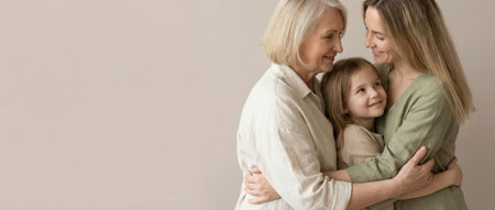 Three generations of women, grandmother, mother, and child, hugging each other, expressing love and togetherness with diverse age groups on a neutral backgroundの素材