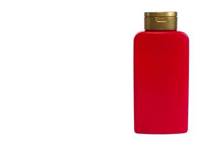 Red cosmetic bottle isolated on wtite backgroundの写真素材