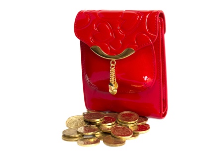 Red glossy leather purse with gold metal  and  gold coins isolated on whiteの写真素材