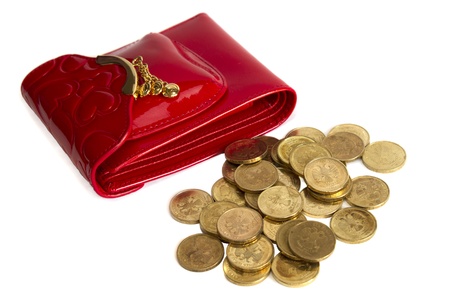Red glossy leather purse with gold metal  and  gold coins isolated on whiteの写真素材