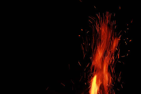 Bright sparks of fireworks on a dark background with a place for the title. High quality photoの写真素材