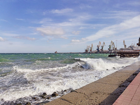 Big green waves break on the shoreの写真素材