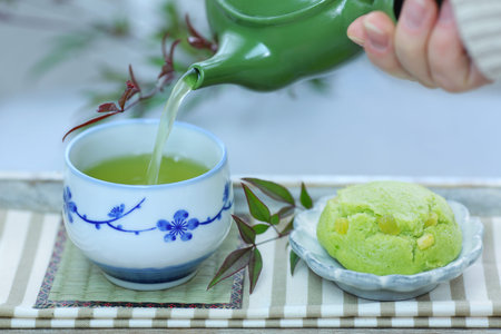 A cup of Japanese green tea and Japanese sweets.