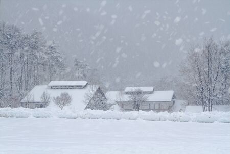 Snow-covered village in the mountainous province of Nagano Prefecture, Japan.の写真素材