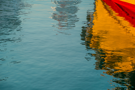 Beautiful reflection of the yacht in the water.の写真素材