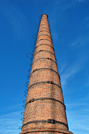 Old brick a flue a pipe strengthened by iron hoopsの写真素材