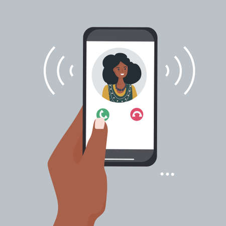 A hand holds a smartphone with an incoming call. Portrait of a person from contacts on the phone screen. Mobile applications and Internet technology. Vector flat illustration.のイラスト素材