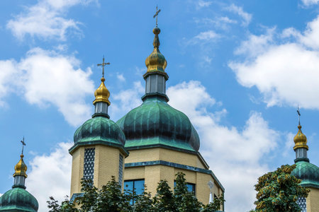 Onion shape domes of orthodox church building  against blue sky