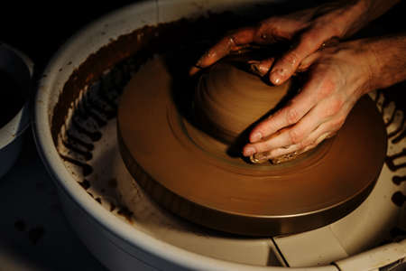The art of pottery creating a jug out of clayの写真素材