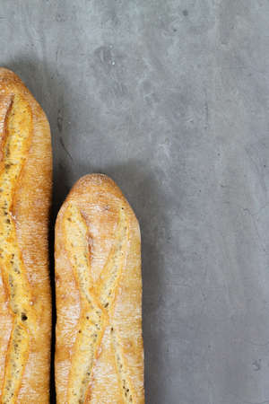 From above photo of french baguette bread on grey concrete background . Copyspace for textの写真素材