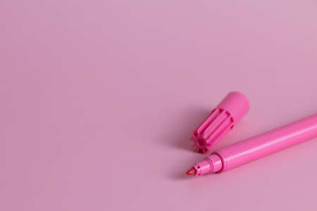 Colorful pink marker pen isolated on pink backgroundの写真素材