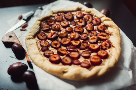 Rustic plum cake on dark background. Top view.の写真素材