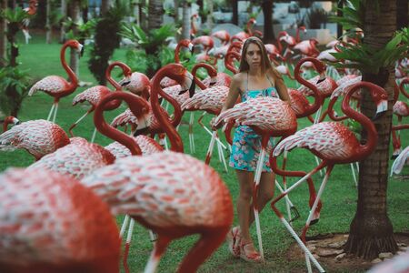 Beautiful girl in a tropical gardenの写真素材