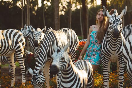 Beautiful girl in a tropical gardenの写真素材