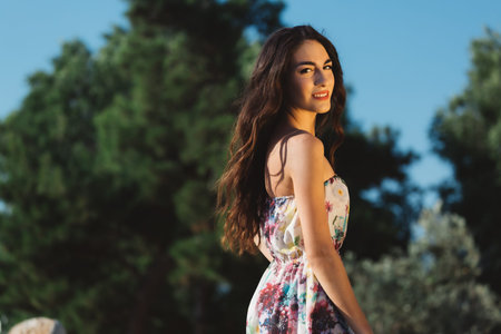 Girl in a dress posing in motion on a street background