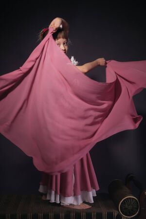 A little girl dressed as an belly dancerの写真素材