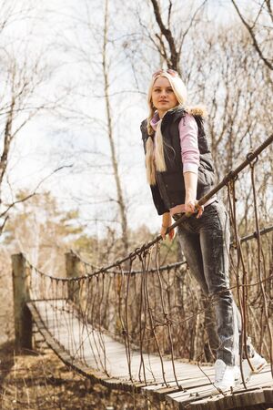 Girl on the suspension bridgeの写真素材