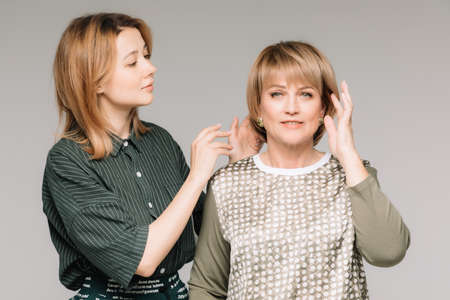 Middle-aged woman posing in the interiorの写真素材