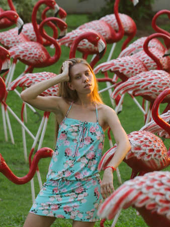 Beautiful girl in a tropical Asian garden.の写真素材