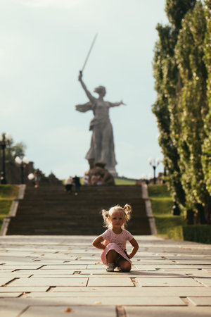 Russia, the city of Volgograd, Mamaev Kurgan, the Motherland Calls statue, a little girl against the...