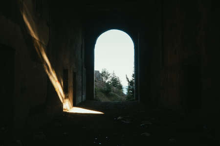 Old dirty broken ruined abandoned building, ruins of the facade of a luxury hotel.の写真素材