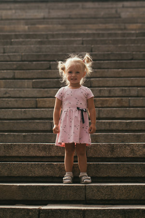 Russia, the city of Volgograd, Mamaev Kurgan, the Motherland Calls statue, a little girl against the background of the statue August 12, 2020の写真素材