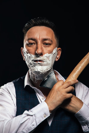 man shaving with ax