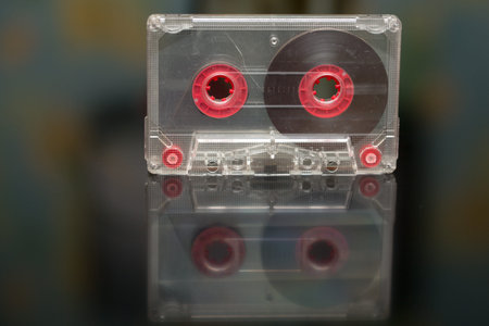 Old audio cassette on a black background, audio recording