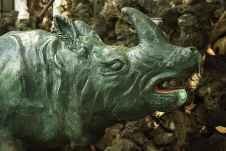 the old concrete statue of a rhinocerosの写真素材