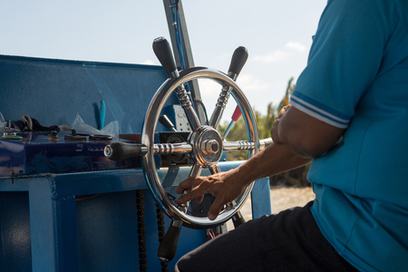 steering wheel on a small boat, hold the steering wheelの写真素材