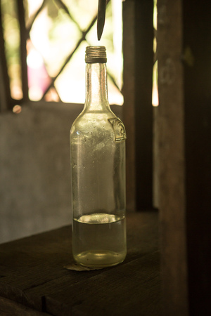 empty oil bottle of clear white glass oneの写真素材