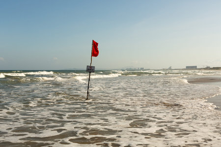 Red warning flag on the beach of Vietnam Cam Ranh