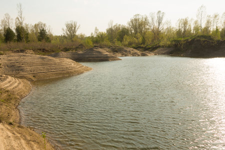 Sand quarry, lagoon Industry Mountains landscape