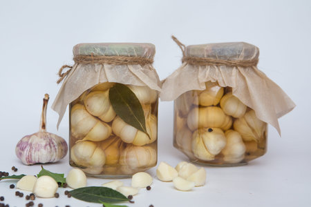 canned vegetables in glass pots jars isolated on a white background an ecological natural food resource for the winter.の写真素材