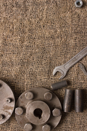 Old hand tools, Pliers screwdriver wrench rusted iron metal tools on Steel plate at garage.